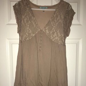 Beige tunic with lace detailing at the top